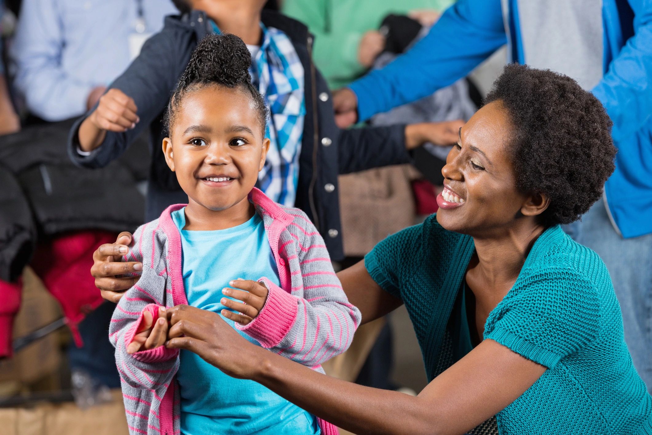 A community event with children playing and receiving gifts